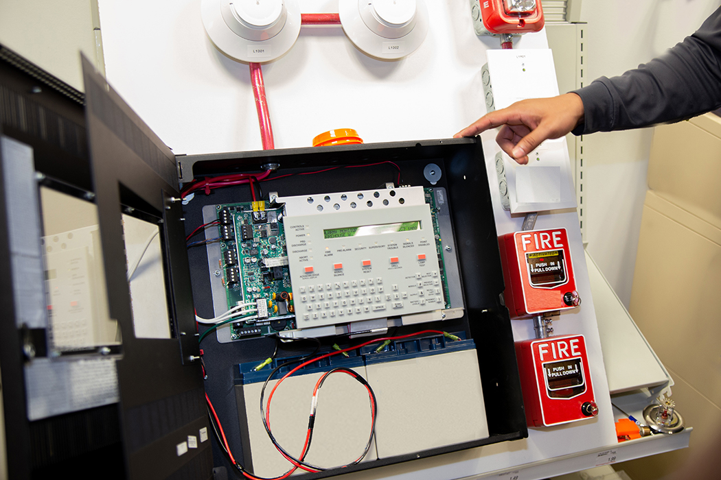 Demonstration board showing various digital alarm systems and how they connect