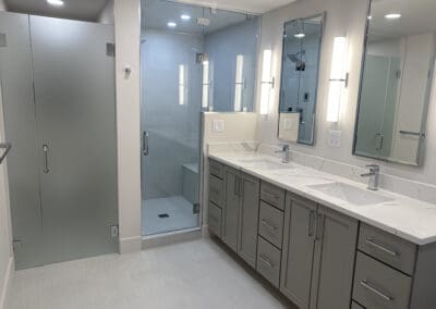 Lights installed in a clean white bathroom