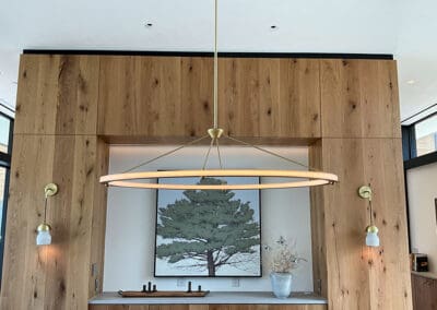 Overhead ring-shaped lamp installed over a table