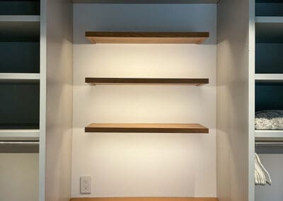 Wooden shelf with ambient lighting installed.