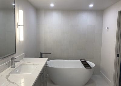 Remodeled light systems in a white bathroom